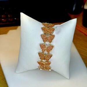 Faux rose gold, pink butterfly stretch bracelet